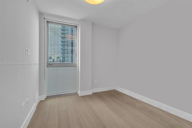 unfurnished room featuring light hardwood / wood-style flooring