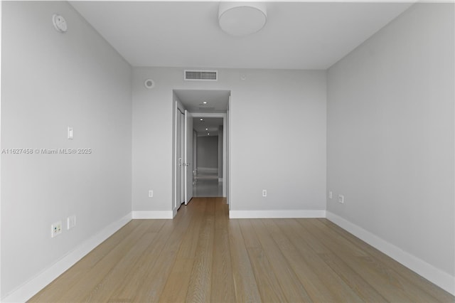 spare room with light wood-type flooring