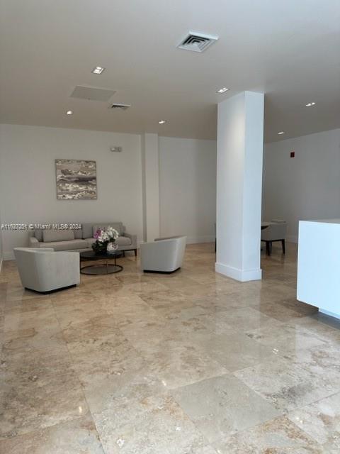 basement featuring light tile patterned floors