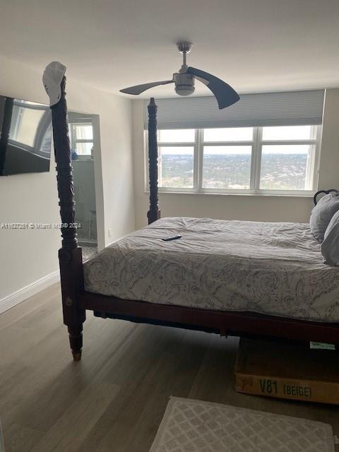 bedroom featuring wood-type flooring and ceiling fan