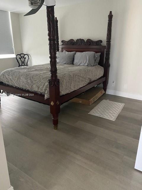 bedroom featuring hardwood / wood-style flooring and ceiling fan