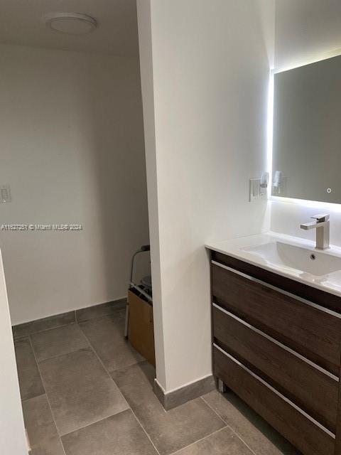 bathroom with vanity and tile patterned floors