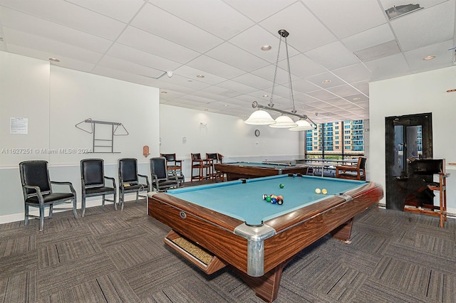 recreation room featuring a paneled ceiling, billiards, and dark colored carpet