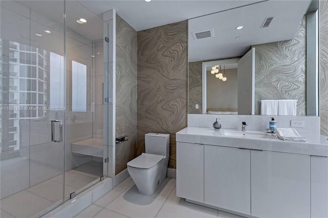 bathroom with vanity, toilet, tile patterned floors, and an enclosed shower