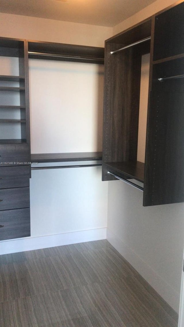 walk in closet featuring hardwood / wood-style flooring