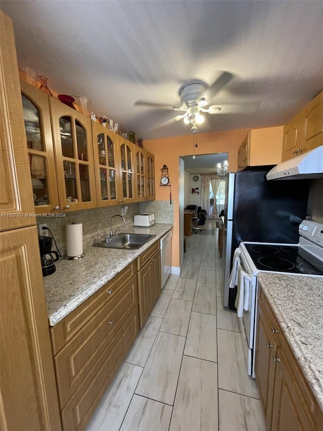 kitchen with white electric range oven, light stone counters, stainless steel dishwasher, and sink