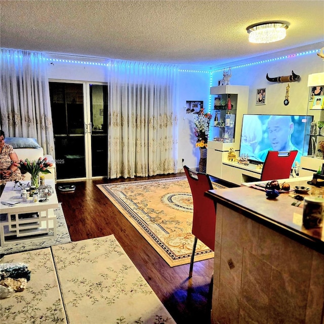 office area featuring hardwood / wood-style flooring and a textured ceiling