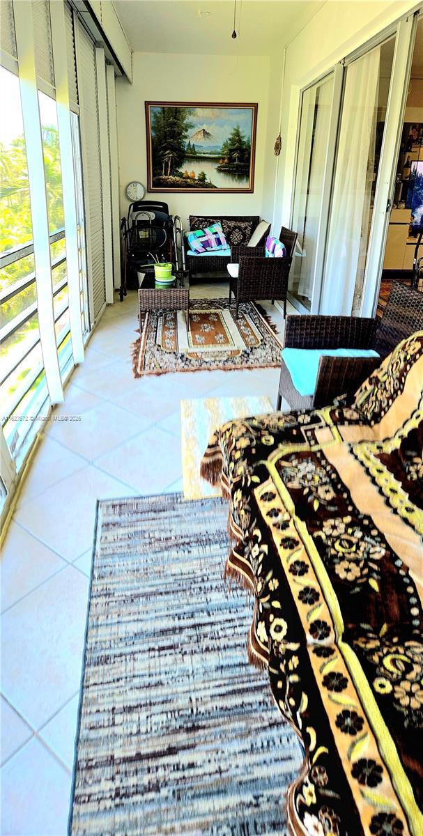 1425 Atlantic Shores Blvd Unit 409, Hallandale Beach, FL 33009 - view of sunroom / solarium