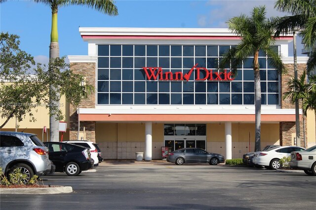 1425 Atlantic Shores Blvd Unit 409, Hallandale Beach, FL 33009 - view of building exterior featuring uncovered parking