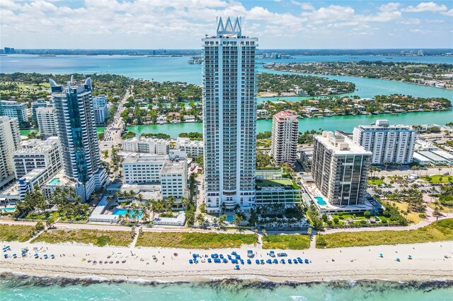 aerial view featuring a view of the beach and a water view