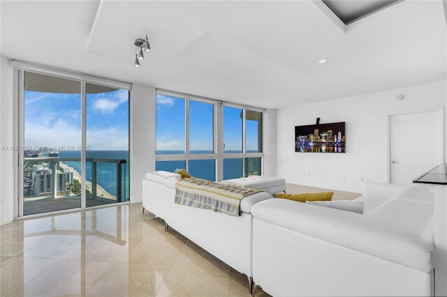 tiled living room with expansive windows