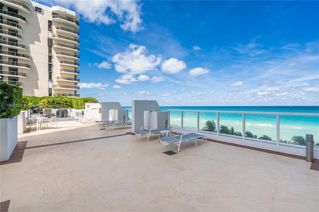 view of patio with a water view