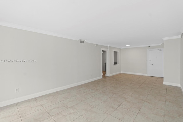 spare room featuring crown molding