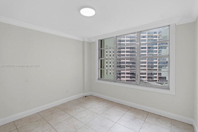 tiled empty room with crown molding