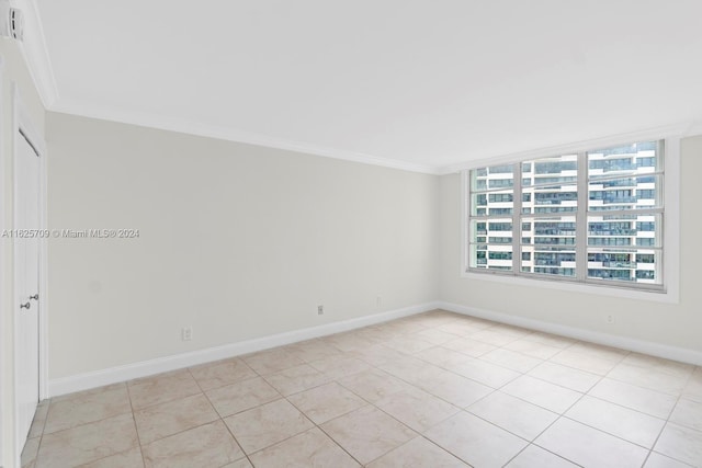 tiled empty room with ornamental molding