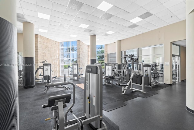 gym with a paneled ceiling