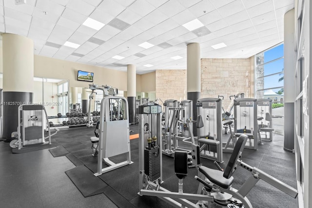 exercise room featuring a drop ceiling