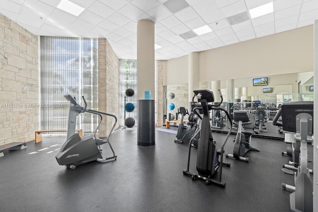 workout area featuring a paneled ceiling