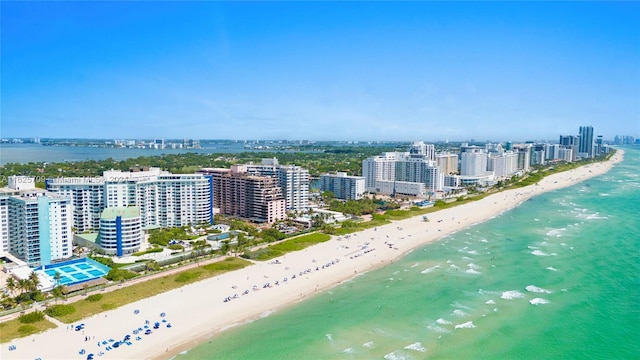 birds eye view of property with a view of the beach and a water view