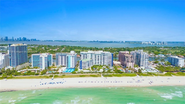 aerial view featuring a water view and a view of the beach