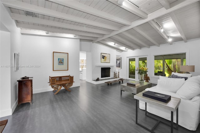 living room with dark wood-type flooring, french doors, vaulted ceiling with beams, and track lighting