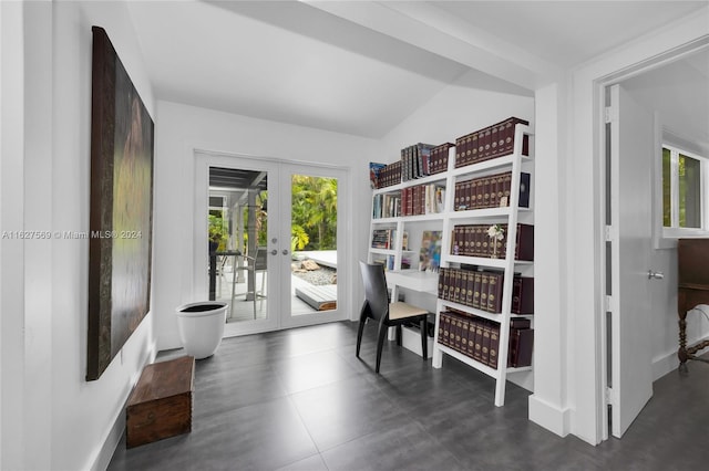 interior space with dark tile patterned flooring, french doors, and a wealth of natural light