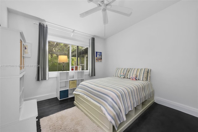 bedroom with dark wood-type flooring and ceiling fan