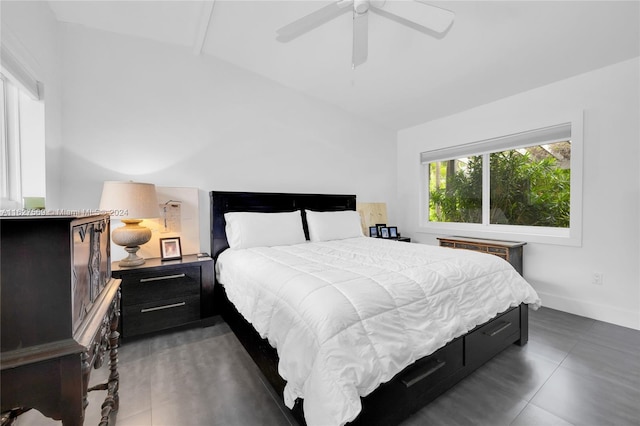 tiled bedroom featuring ceiling fan and vaulted ceiling