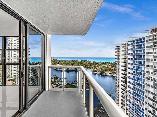 balcony featuring a water view