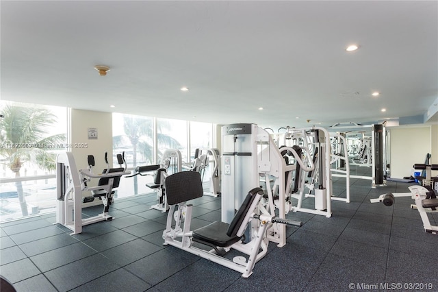 exercise room with floor to ceiling windows