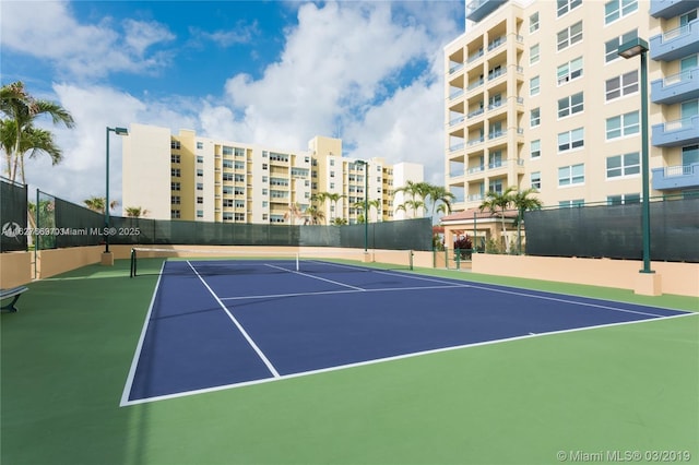 view of tennis court featuring basketball court