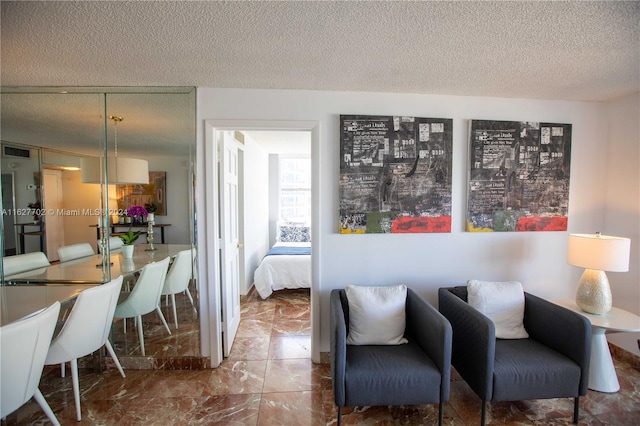 living room with a textured ceiling