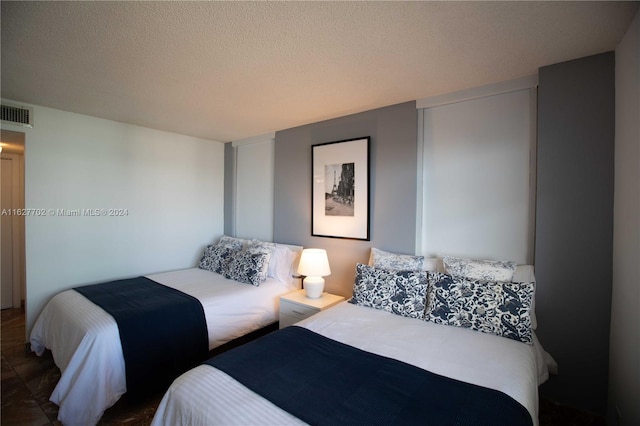 bedroom featuring a textured ceiling