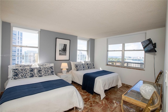 bedroom featuring a textured ceiling