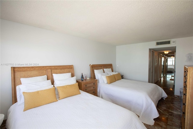 bedroom featuring a textured ceiling