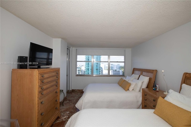 bedroom featuring a textured ceiling