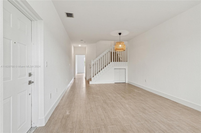 spare room with light hardwood / wood-style flooring