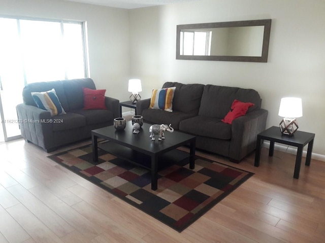 121 SE 3rd Ave Unit 201, Dania Beach, FL 33004 - living area with wood finished floors