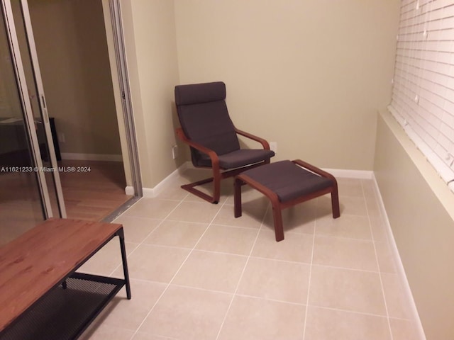 sitting room with light tile patterned flooring