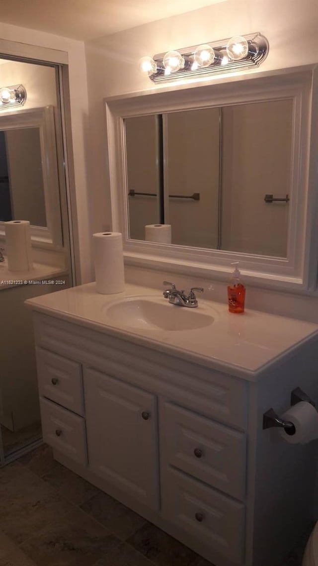 bathroom with vanity and tile patterned floors