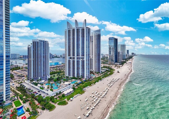 property's view of city with a view of the beach and a water view