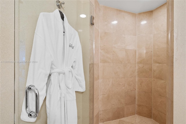 bathroom with a tile shower