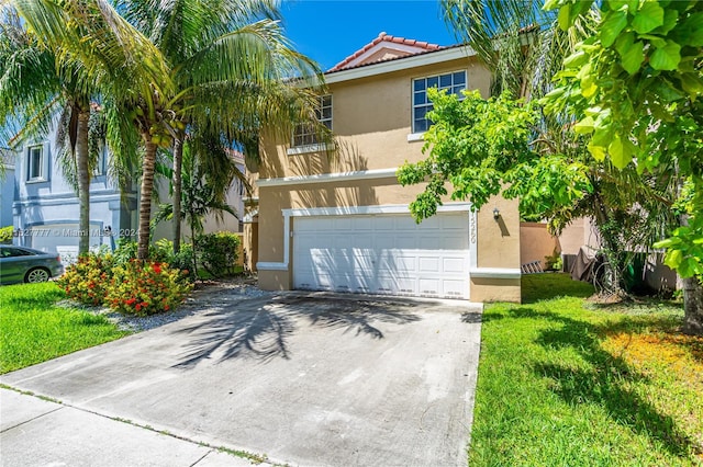 view of front facade with a garage and a front yard