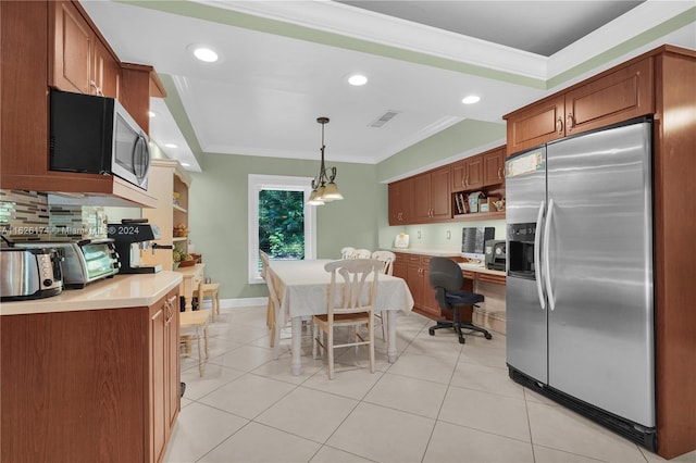 kitchen with crown molding, stainless steel appliances, light tile patterned floors, and hanging light fixtures