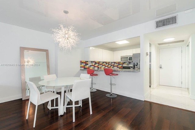 dining area with dark wood-type flooring