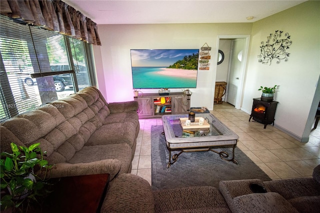 tiled living room featuring a wood stove