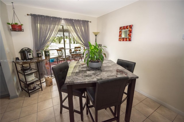 view of tiled dining space