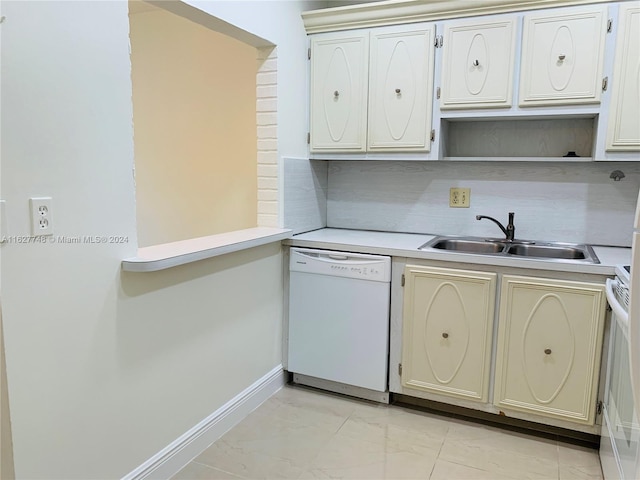 kitchen featuring light tile patterned flooring, white cabinets, dishwasher, decorative backsplash, and sink