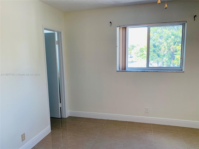 view of tiled spare room