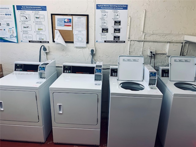 laundry area with washing machine and dryer